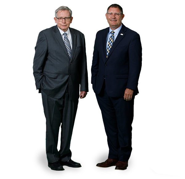 Robert H and S Gallagher, and Peter Geirut posing together in a conference room